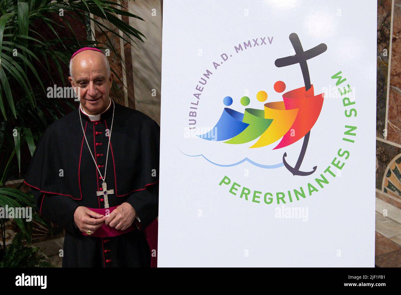 Vatican City, Vatican. 28 June 2022. Rino Fisichella Pro-prefect of the Dicastery for Evangelization, poses with the logo during during the presentation of the logo of the Jubilee 2025, MMXXV Pilgrims of Hope, at the Regia Hall of the Apostolic Palace.  (Photo by Vatican Media). Credit: Vatican Media/Picciarella/Alamy Live News Stock Photo