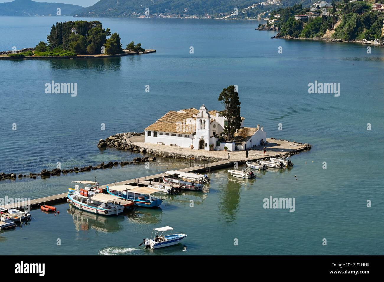 Corfu, Greece - June 2022: Aerial view of the Vlacherna Monastery set on a bay of water near Corfu town Stock Photo