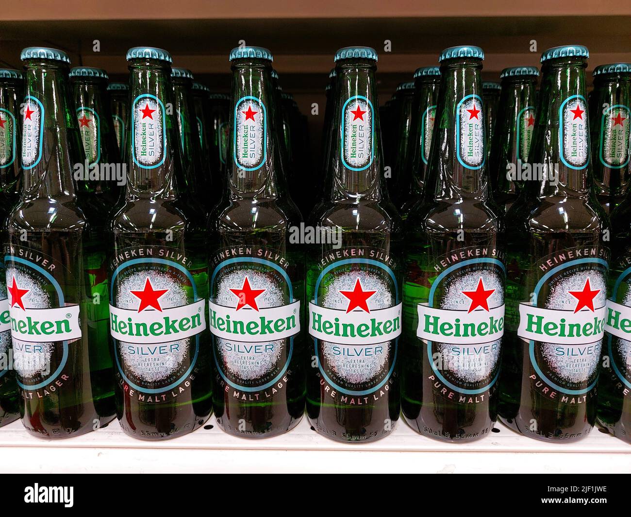 Heineken Silver beer bottles in a supermarket Stock Photo Alamy
