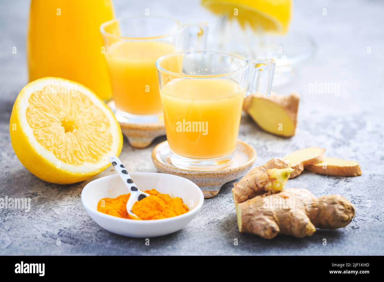 Close up of healthy Ginger Lemon Turmeric Shot – ideal to boost the immune system Stock Photo