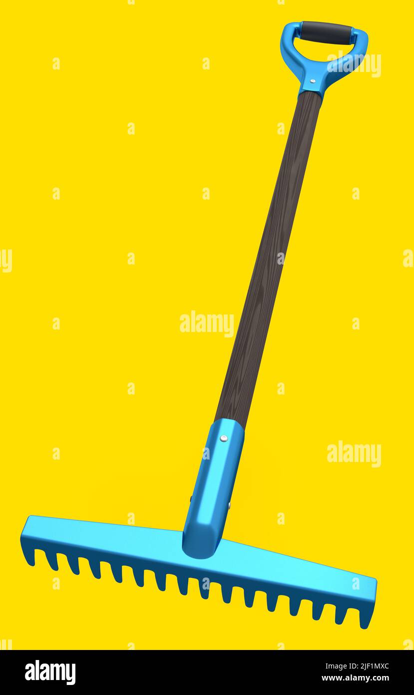 Garden rake with wooden handle for harvesting hay on yellow background ...