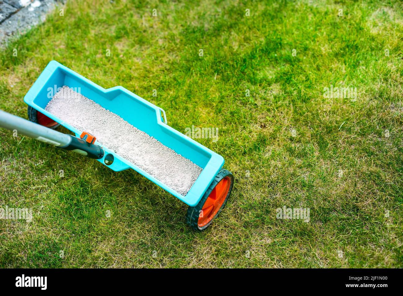 Lawn care - Lawn Spring Fertilization tool Stock Photo