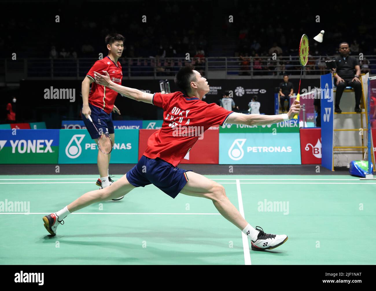 Kuala Lumpur, Malaysia. 28th June, 2022. Liu Yu Chen and Ou Xuan Yi of China compete against Yet Jun Chang and Roy King Yap during the Men's Doubles round one match of the Petronas Malaysia Open 2022 at Axiata Arena, Bukit Jalil. Credit: SOPA Images Limited/Alamy Live News Stock Photo
