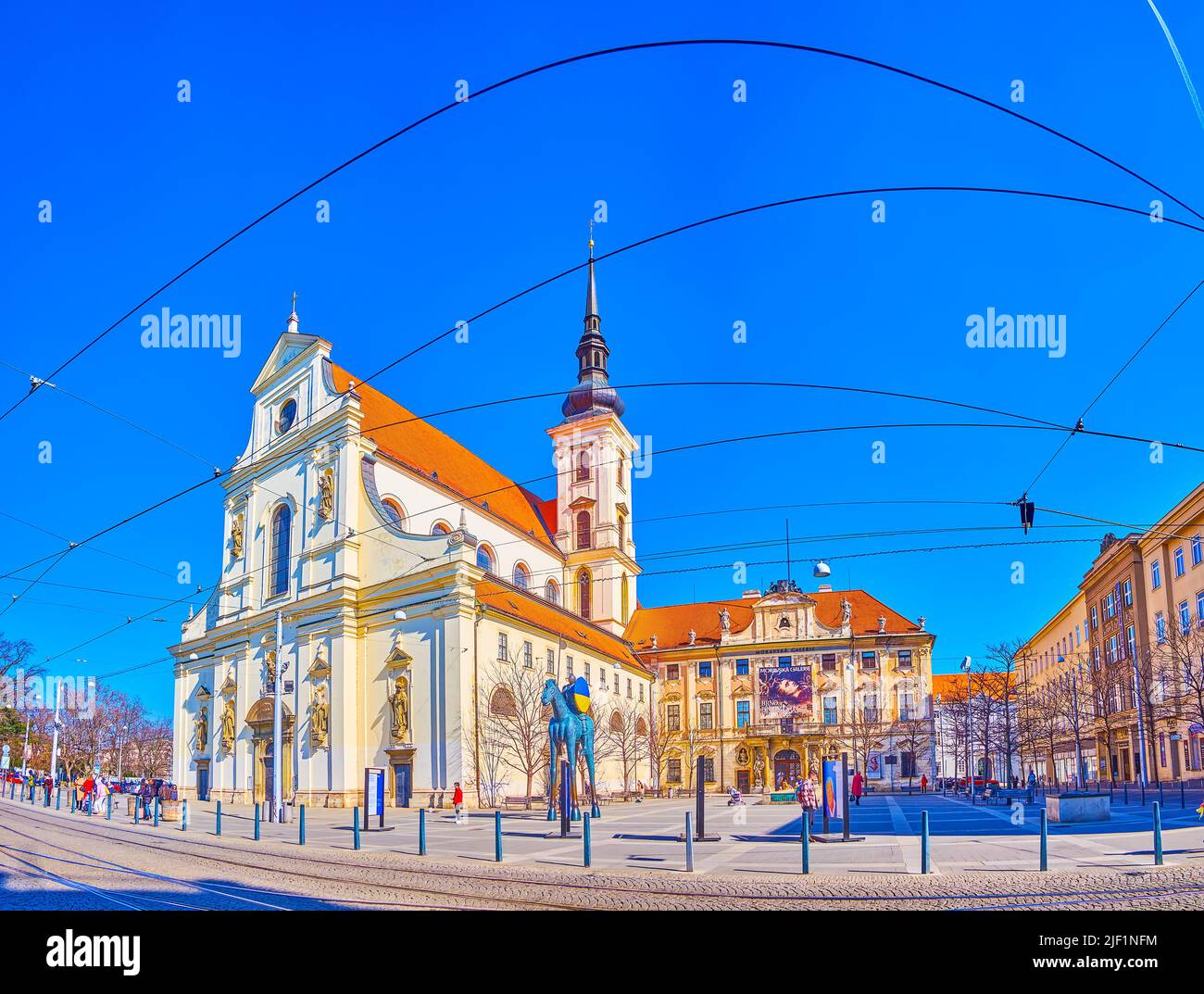 BRNO, CZECH REPUBLIC - MARCH 10, 2022: Panorama of Moravian Square with its main landmark the Church of St. Thomas with high bel ltower, on March 10 i Stock Photo