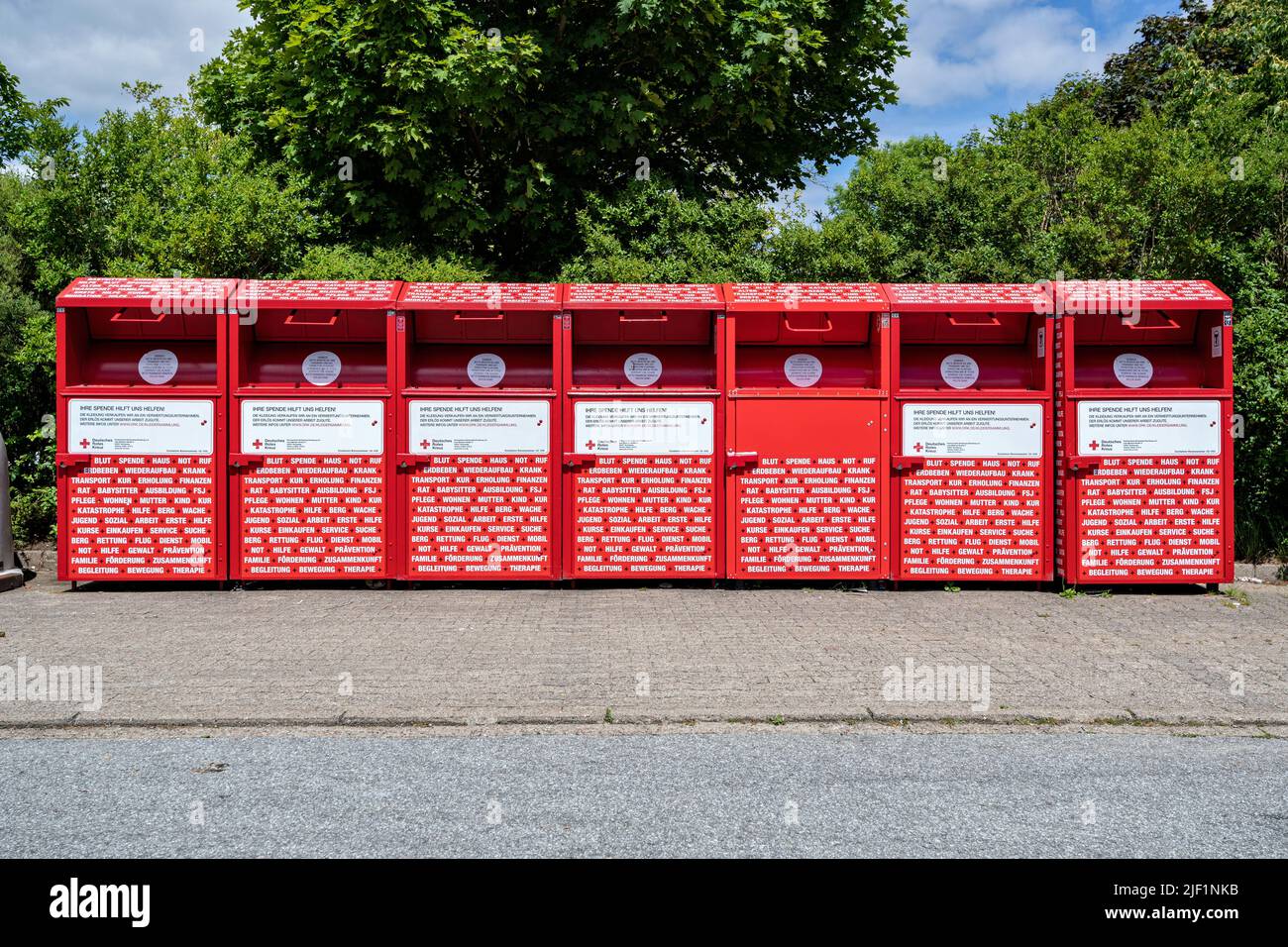 group of charity collection bins of the German Red Cross Stock Photo