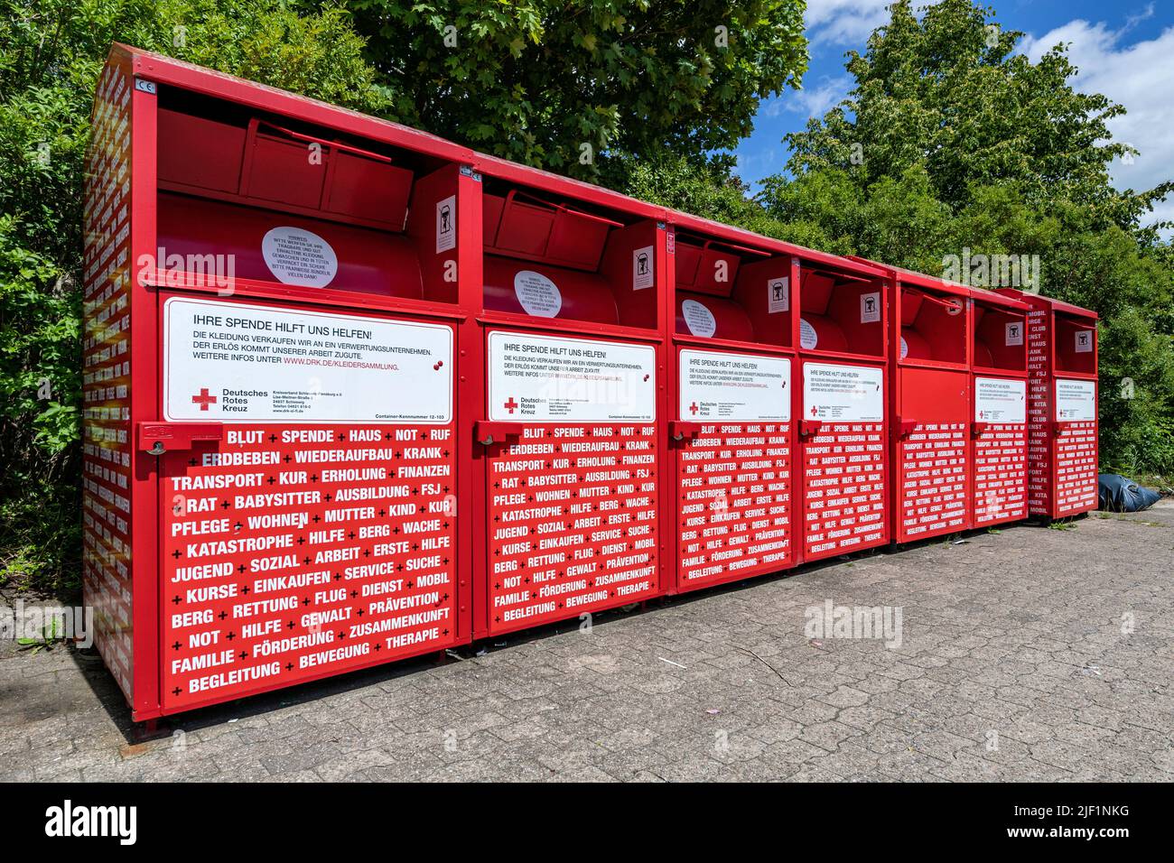 group of charity collection bins of the German Red Cross Stock Photo