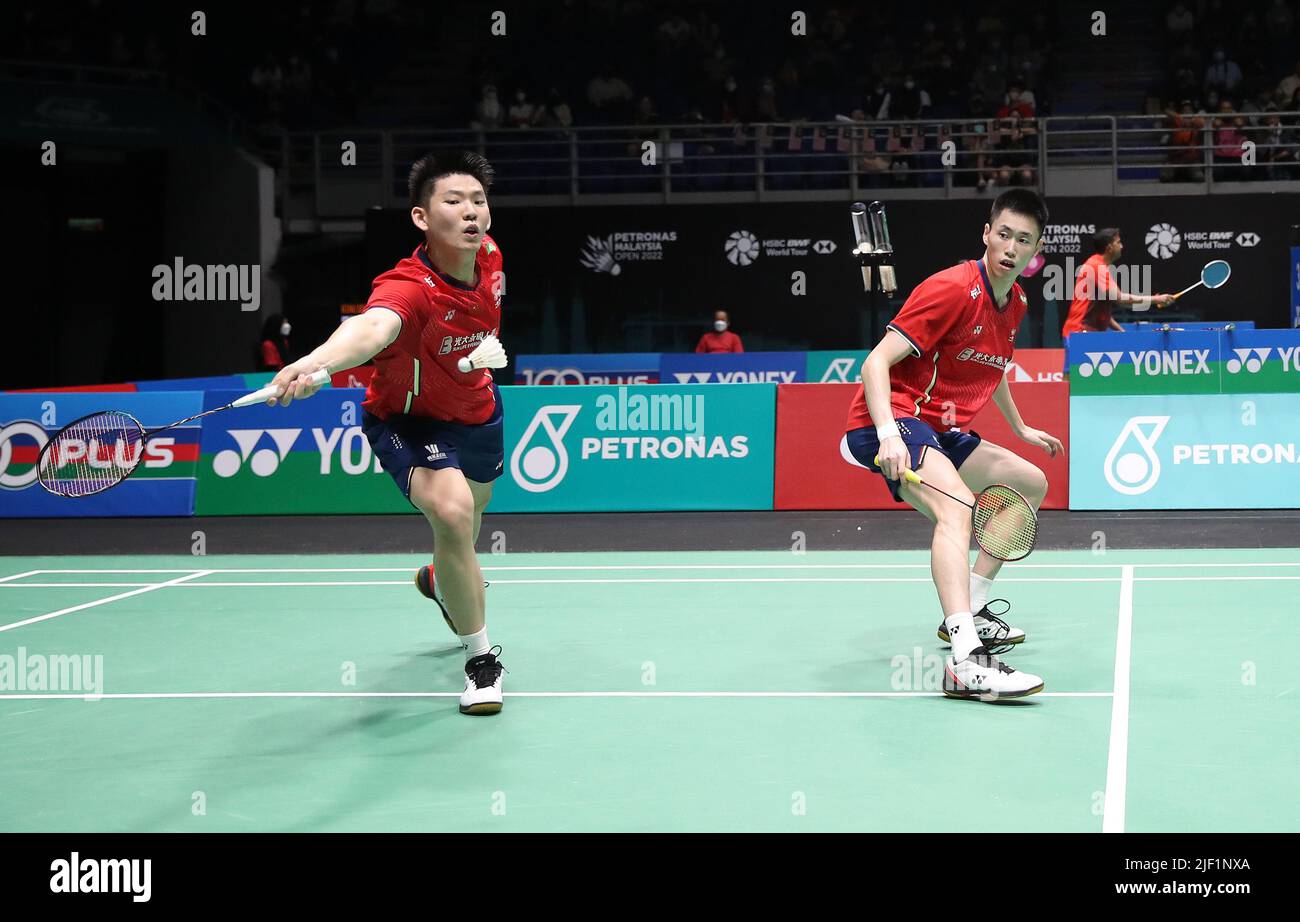 Liu Yu Chen and Ou Xuan Yi of China compete against Yet Jun Chang and ...