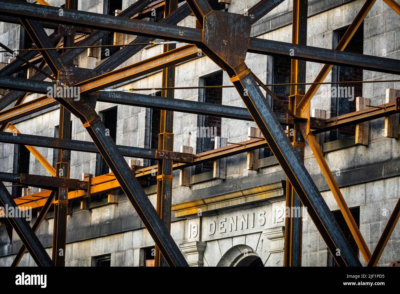Steel shoring structure supports the facade of an old building prior to ...