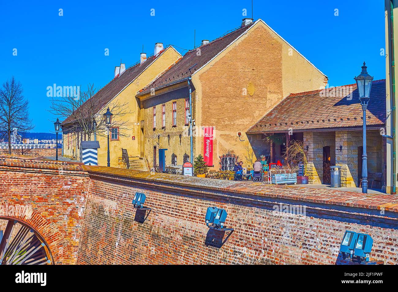 BRNO, CZECH REPUBLIC - MARCH 10, 2022: The small local restaurant with outdoor terrace on the yard of Spilberk Castle, on March 10 in Brno, Czech Repu Stock Photo