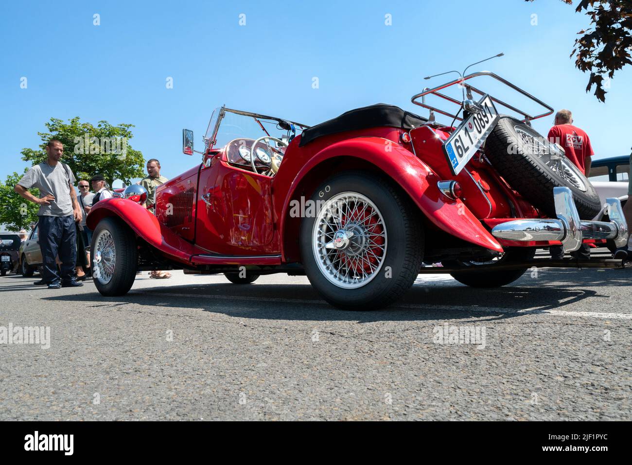 Ostrava, Czechia - 06.05.2022: High angle from behind shot of red Panther Lima MK1 convertible veteran car. People admiring retro cars during veteran Stock Photo