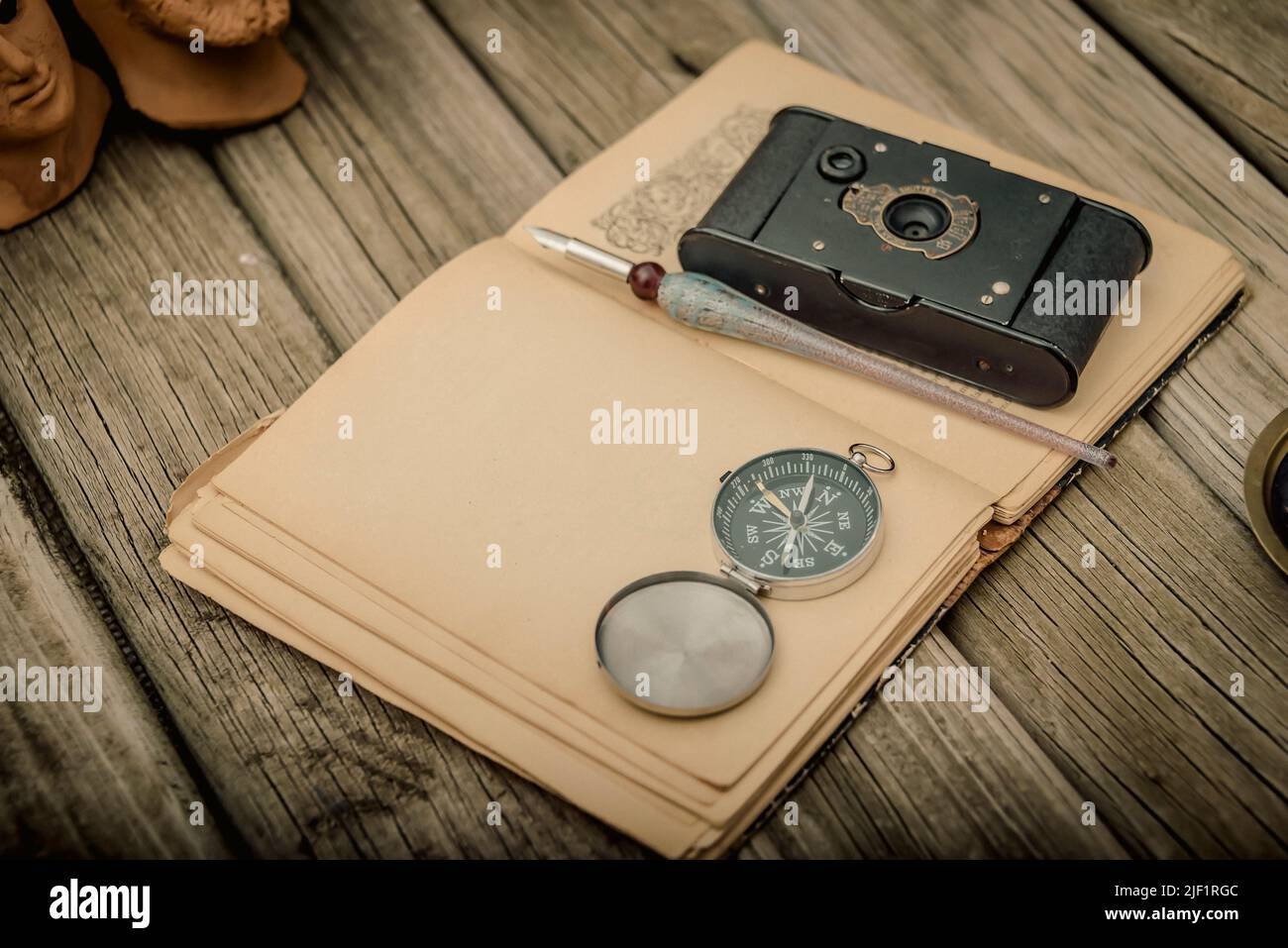 Traveler's accessories and costume on wooden background with copy space , travel concept. Stock Photo