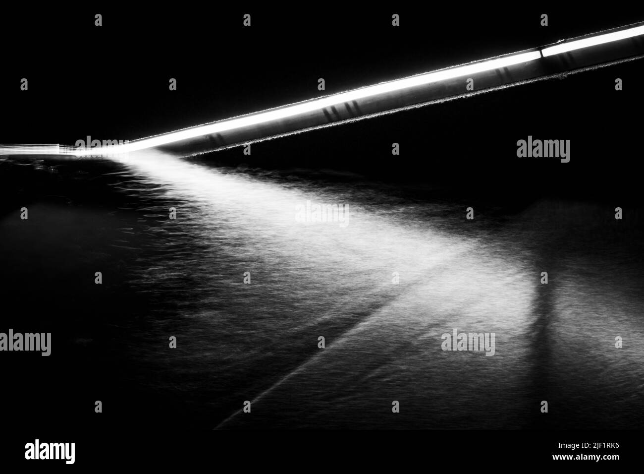 Illuminated stone steps enter the waters of Halifax Harbour along the