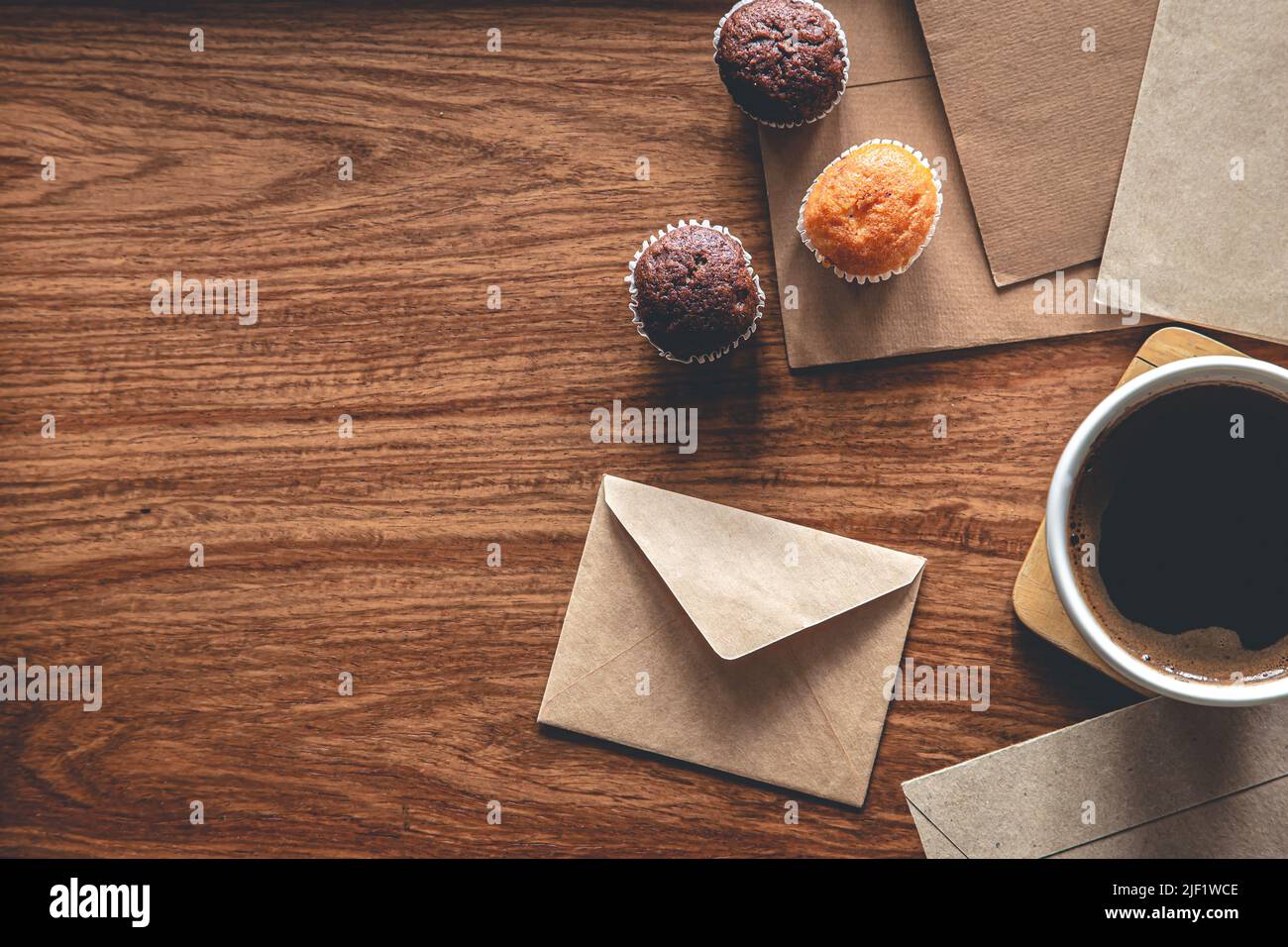 Vintage composition with envelopes on wooden background, flat lay. Stock Photo