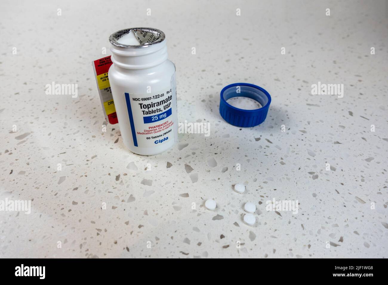 Seattle, WA USA - circa May 2022: Angled view of a bottle of Topiramate medication on a white counter top. Stock Photo