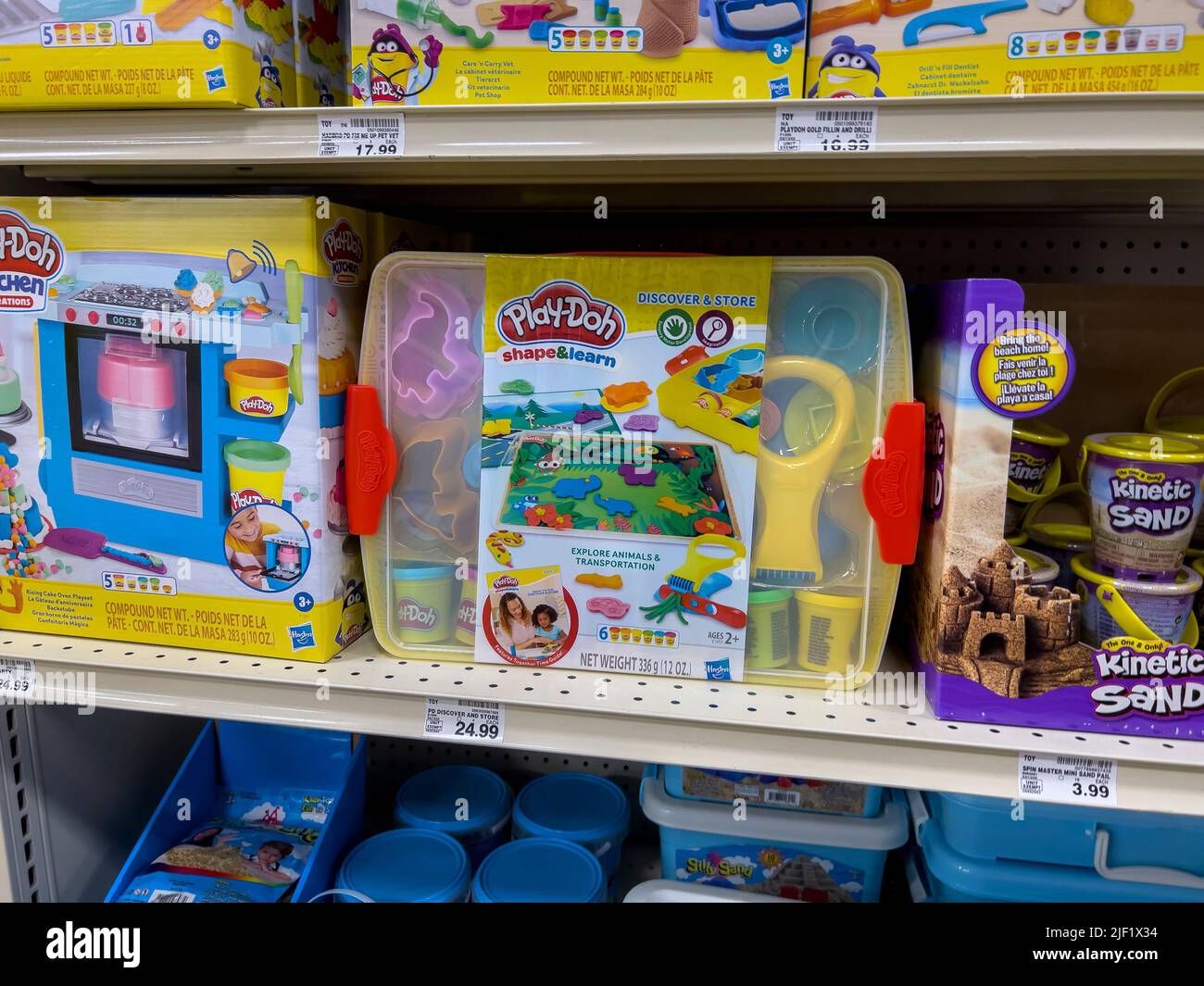 Everett, WA USA - circa June 2022: Close up view of a variety of Play Doh products for sale inside a Fred Meyer grocery store. Stock Photo