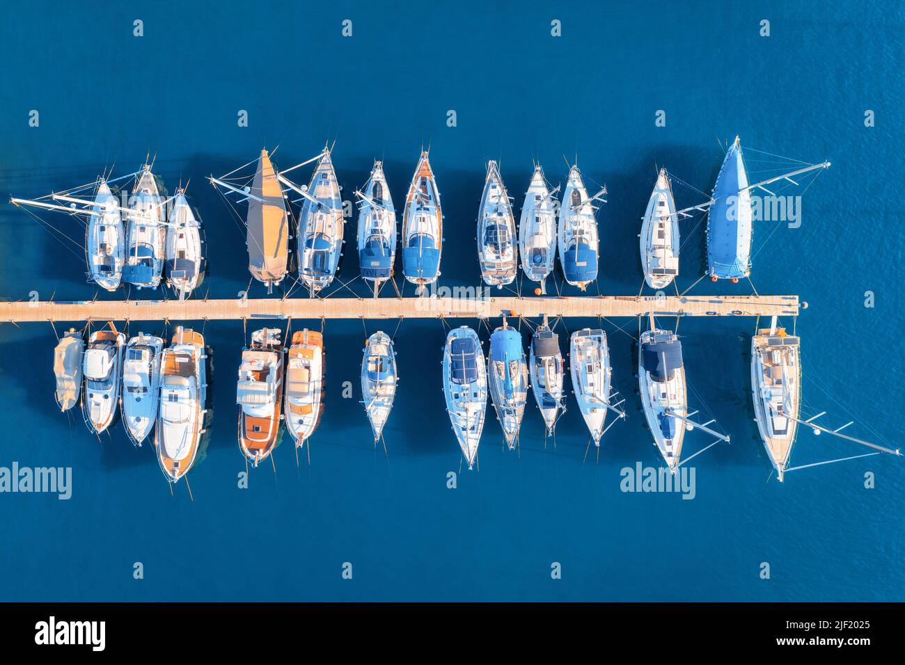 Aerial view of boats and yachts in dock at sunset in summer Stock Photo