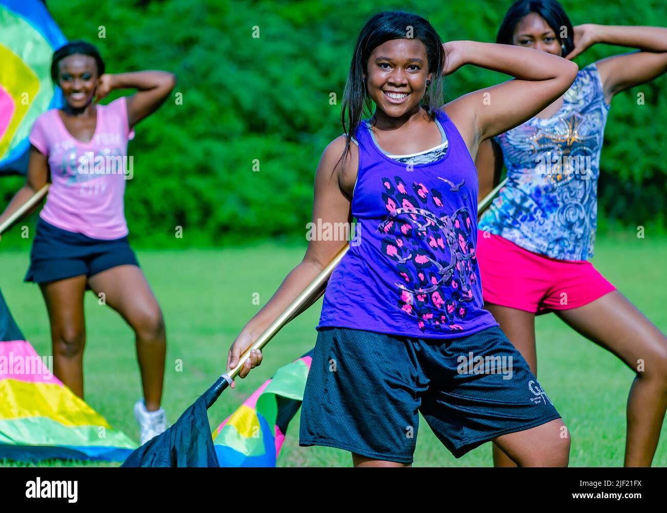 Members of the Columbus High School color guard twirl their flags during band practice, Aug. 16, 2012, in Columbus, Mississippi. Stock Photo