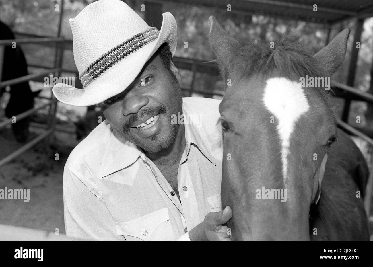Musician Billy Preston out back with his horse at his home in Topanga Canyon, Nov. 1979 Stock Photo