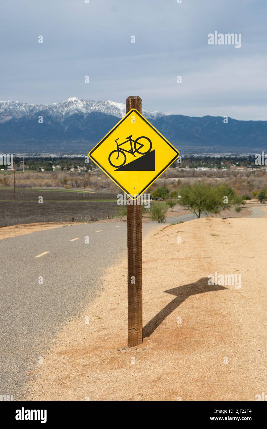 Downhill grade sign along a suburban bicycle trail Stock Photo Alamy