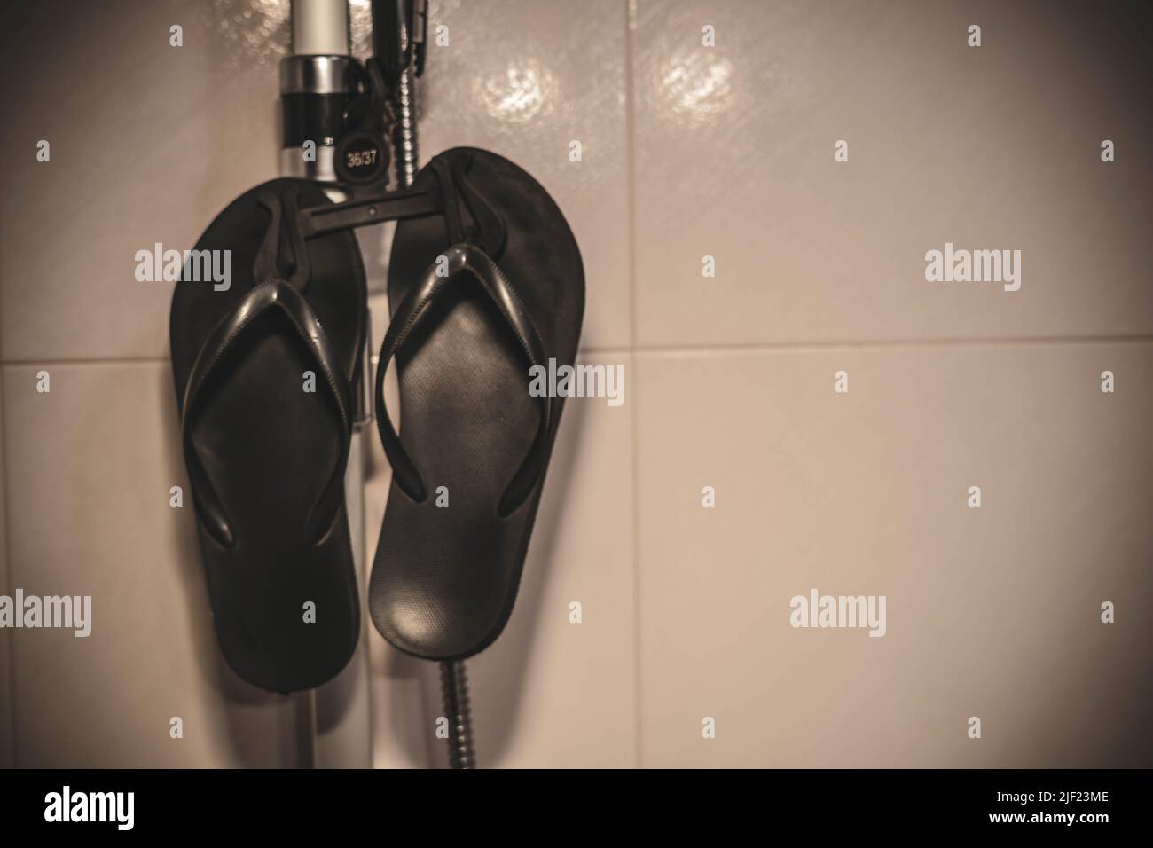 flipflops in the shower Stock Photo Alamy