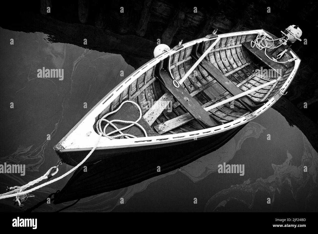 Traditional wooden rowboat with an old outboard motor Stock Photo - Alamy