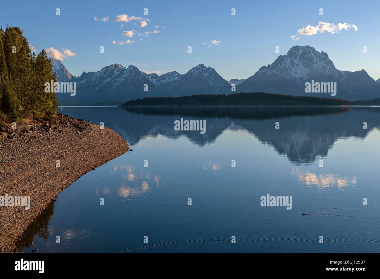 The Tetons and lake Jenny at sunset Wyoming state. Stock Photo