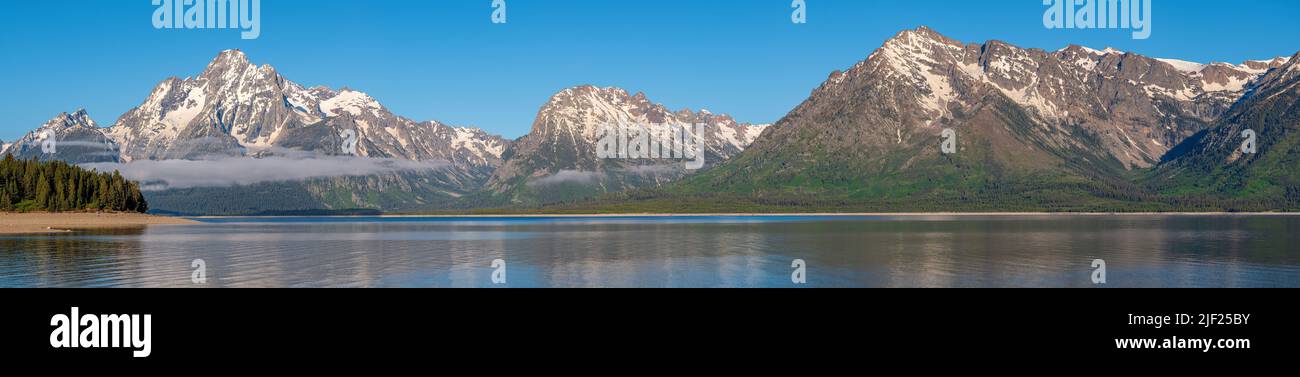Tetons mountains panorama and lake Jenny view in morning light. Stock Photo