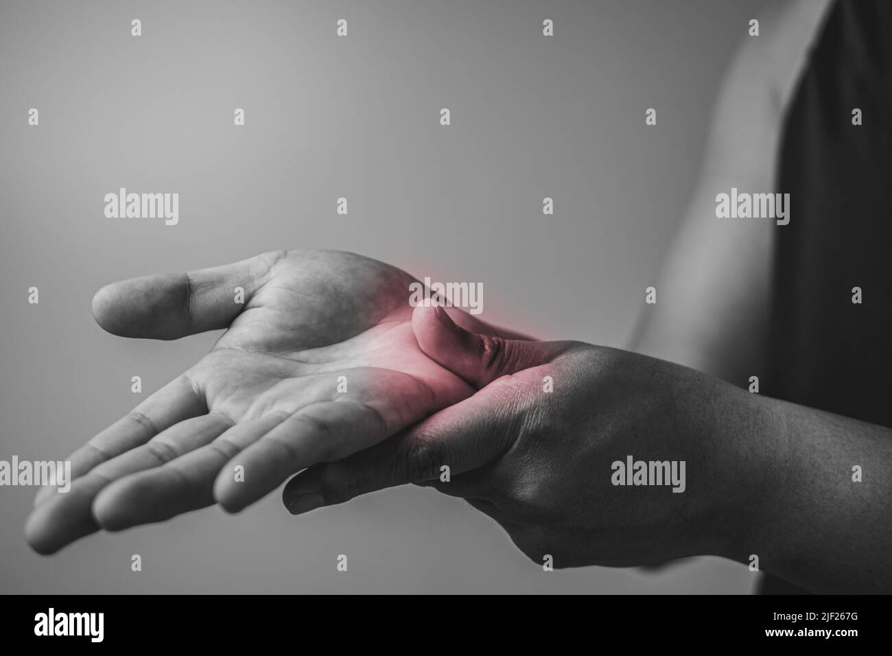 Elbow injury from tennis and golf. The man uses fingers to massage his