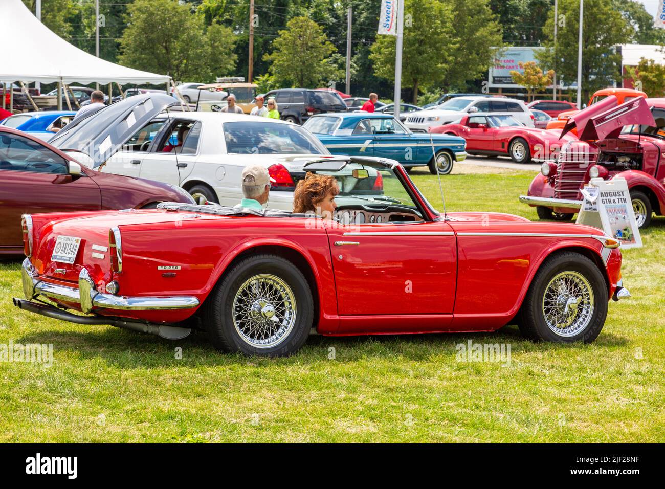 A red 1968 Triumph TR 250 convertible sports car at a car show in Fort Wayne, Indiana, USA. Stock Photo