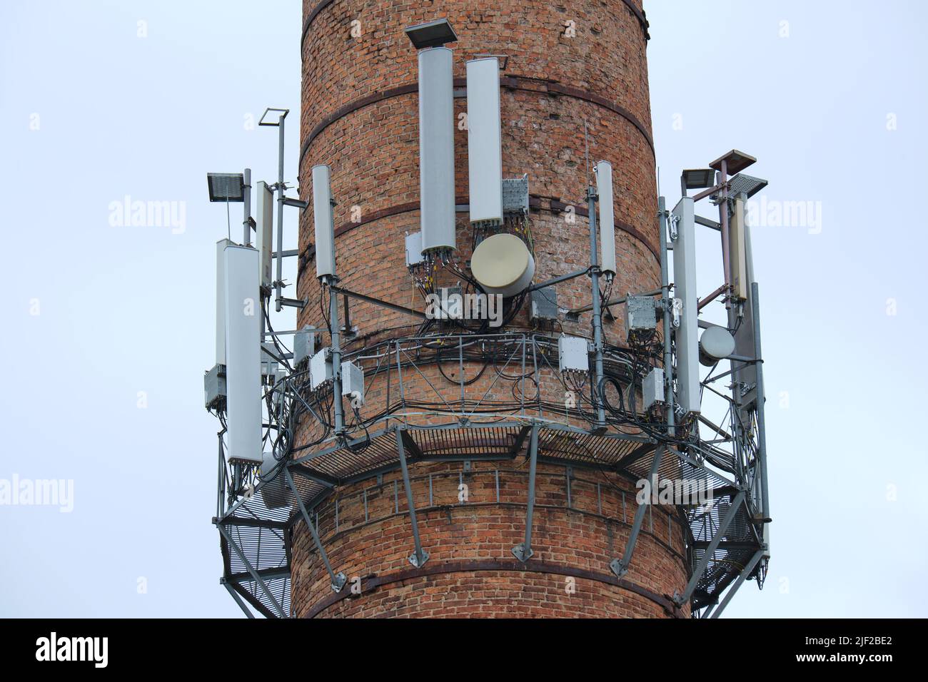 Closeup and detailed view of various GPS, cellphone, 3G, 4G and 5G equipped telecommunication tower. Stock Photo