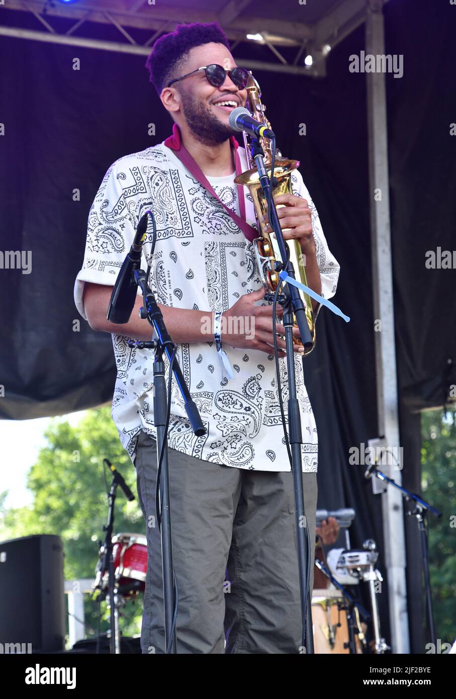 Singer, songwriter and musician Mtali Banda is shown performing on stage during a “live” concert appearance at the Green River Festival. Stock Photo