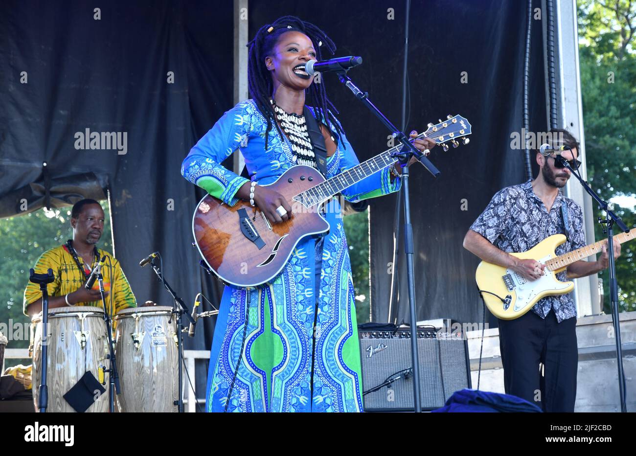 Singer, songwriter and musician Natu Camara is shown performing on stage during a “live” concert appearance at the Green River Festival. Stock Photo