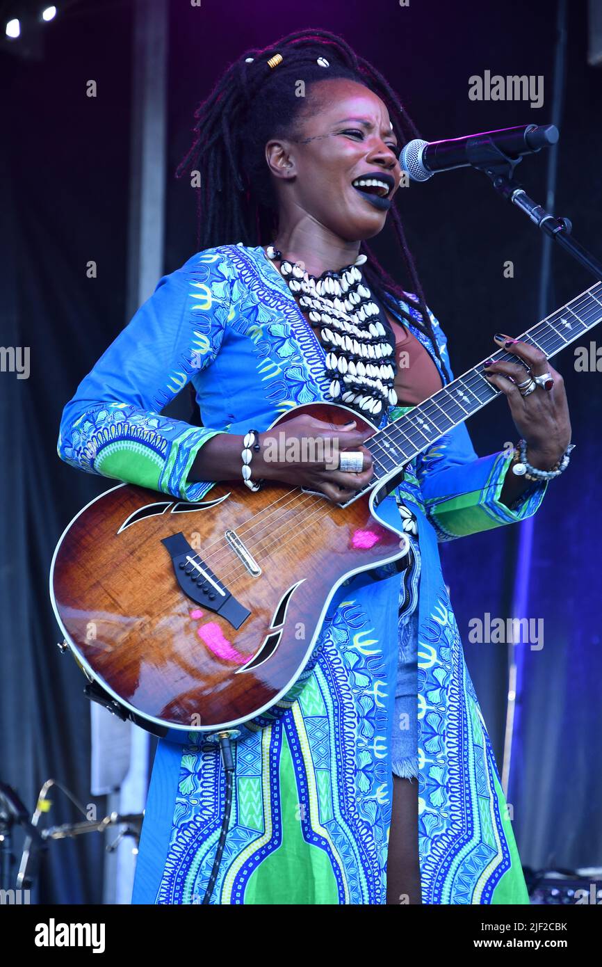 Singer, songwriter and musician Natu Camara is shown performing on stage during a “live” concert appearance at the Green River Festival. Stock Photo