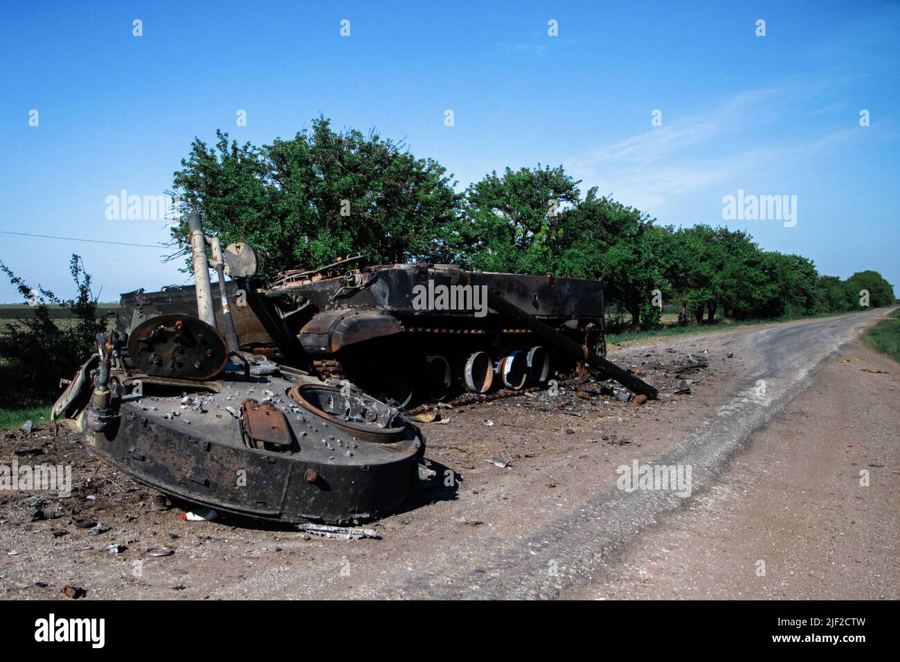 Destroyed Russian tank next to the military Checkpoint. Ukrainian military soldiers have their base at a checkpoint near Huliaipole, Zaporizhzhya region. Russian shelling attacks occur in the area from time to time. Russian troops are attempting to concentrate their efforts on this area. Therefore, Ukrainian soldiers have to be always prepared for the worst. Stock Photo