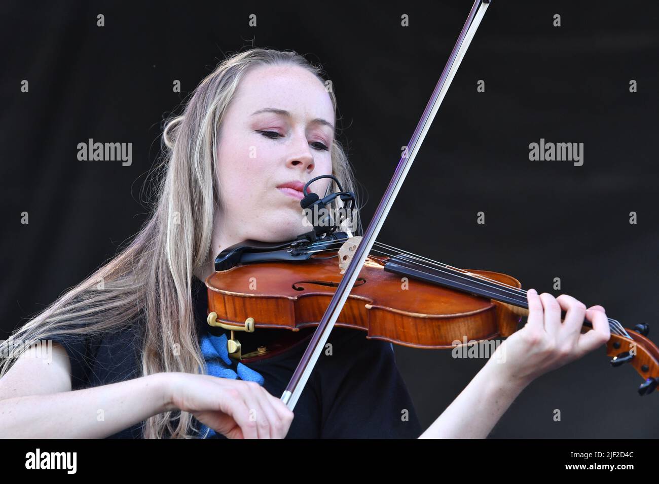 Fiddle player Bronwyn Keith-Hynes is shown performing on stage during a  “live” concert appearance with Molly Tuttle and The Golden Highway at the  Green River Festival Stock Photo - Alamy