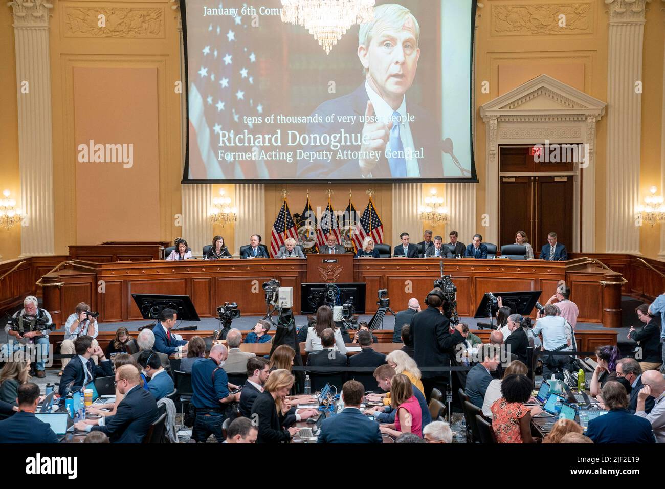 Washington, US, June 28, 2022, A photo of Richard Donoghue, former acting Deputy Attorney General, is displayed as Cassidy Hutchinson, former Special Assistant to President Trump, testifies during the sixth public hearing by the House Select Committee to Investigate the January 6th Attack on the U.S. Capitol on June 28, 2022 in Washington, DC, USA. Cassidy Hutchinson, top aide to former White House chief of staff Mark Meadows was a young, fast-rising star in the Trump administration. She revealed that she heard President Donald Trump say on the morning of Jan. 6 that he knew his supporters had Stock Photo