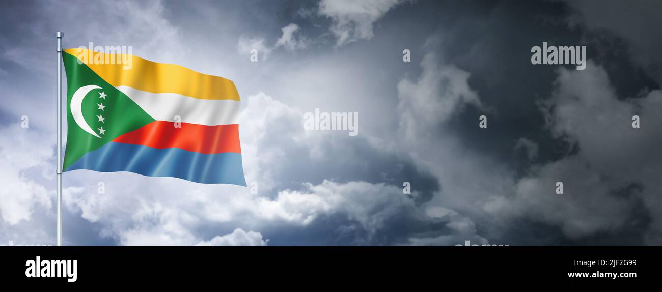 Comoros flag on a cloudy sky, three dimensional render Stock Photo