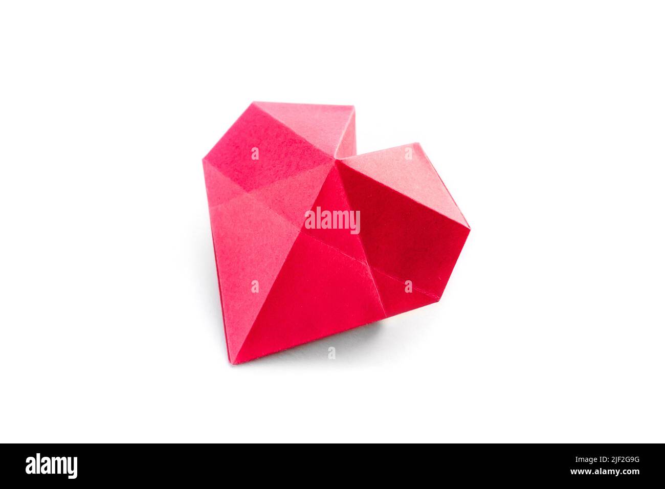 Red paper heart origami isolated on a blank white background. Valentines day card Stock Photo