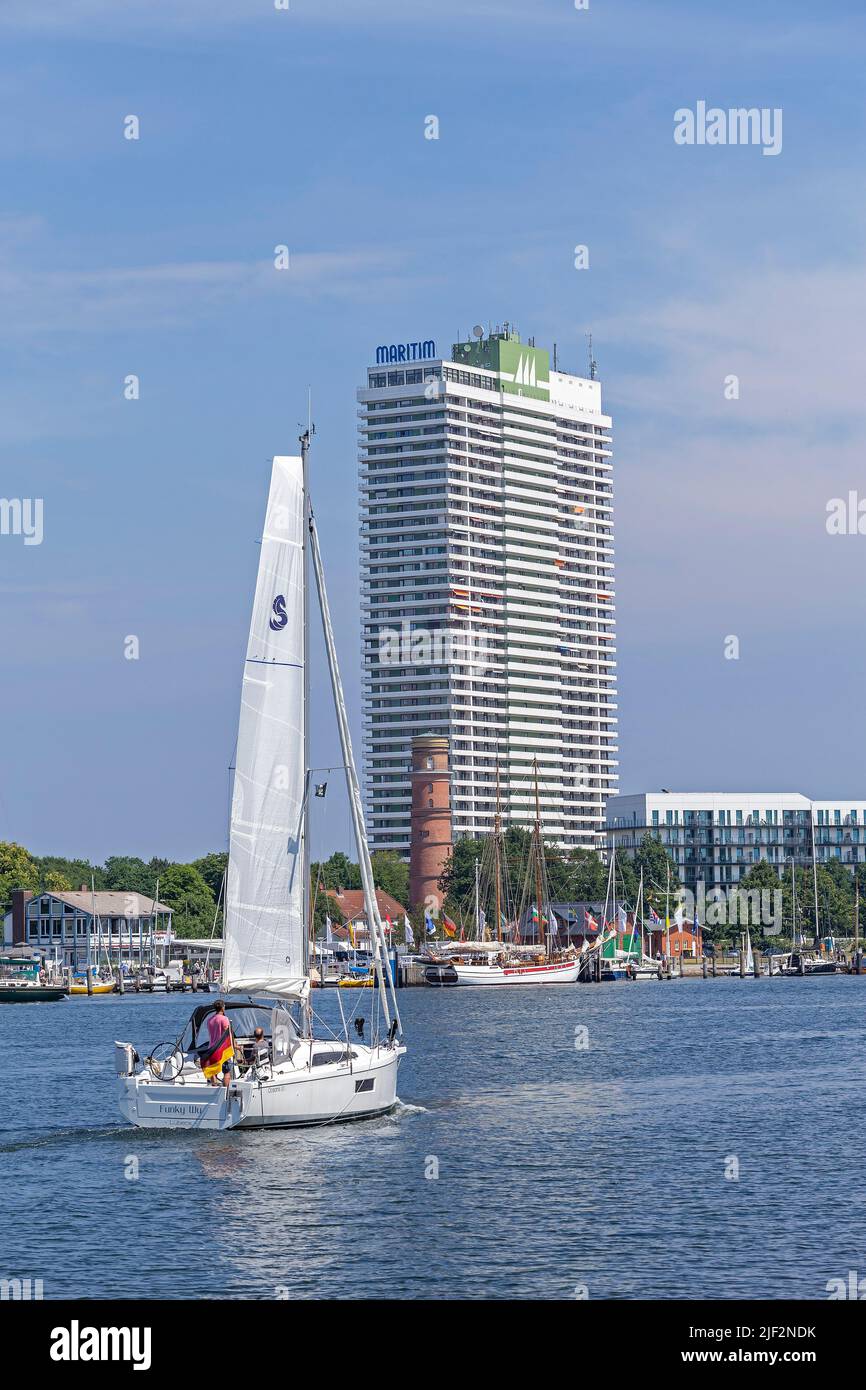 Old lighthouse, sailing boat, Hotel Maritim, Travemünde, Lübeck, Schleswig-Holstein, Germany Stock Photo