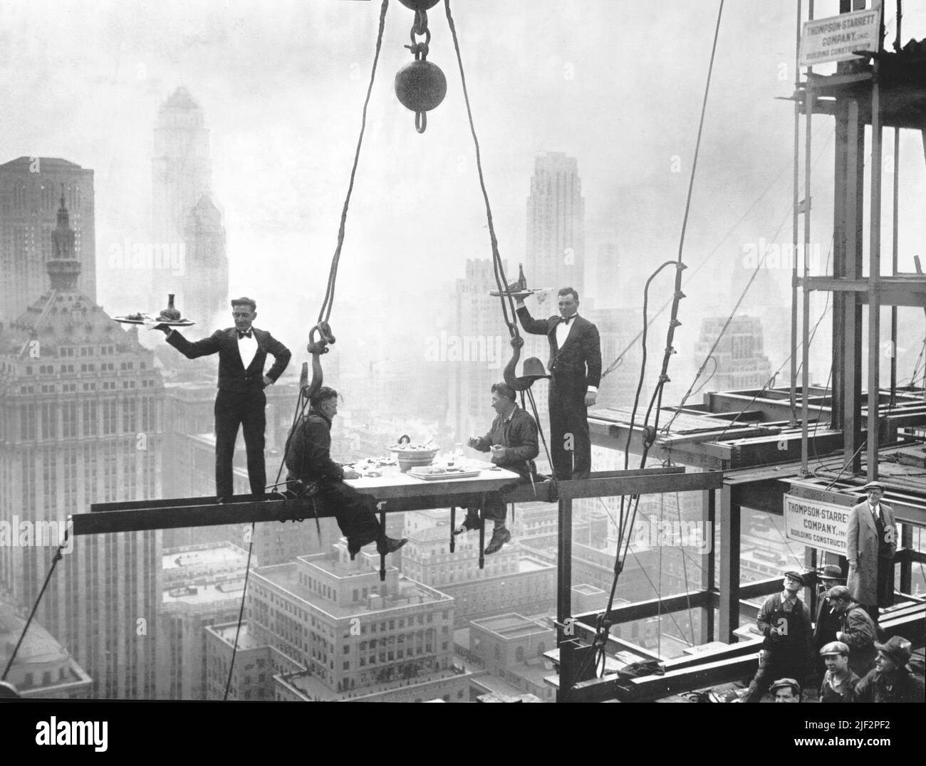 Two Waiters Serve Two Steel Workers on Steel Girders on the Waldorf Astoria Hotel Construction - Quirky Iconic Photography, New York City, USA - 1930 Stock Photo