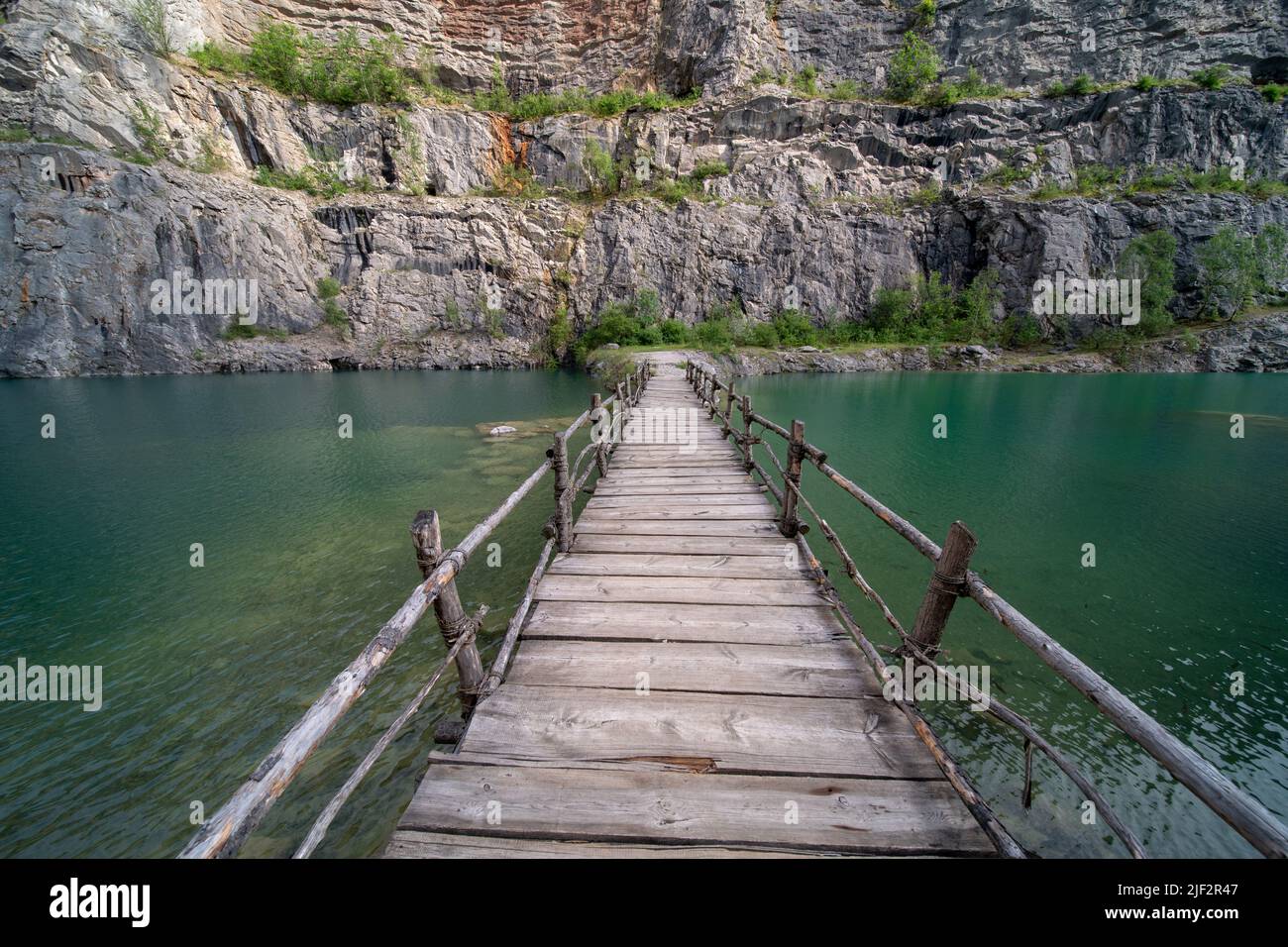 Wooden bridge bulit by filmmakers in a flooded limestone quarry "Velká
