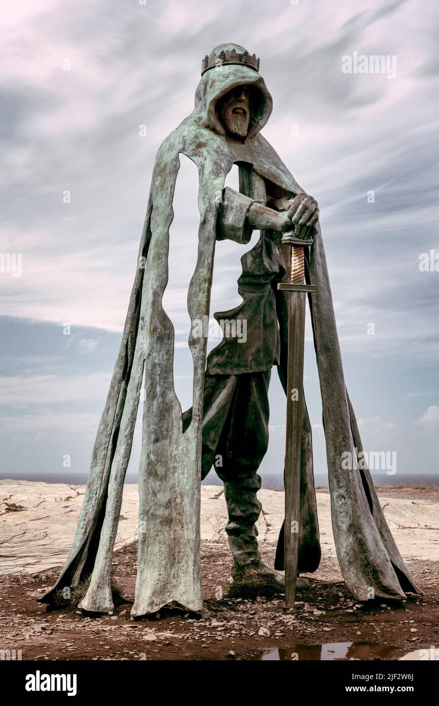 Gallos - The imposing eight foot tall bronze sculpture by Rubin Eynon is a popular attraction with tourists to Tintagel Castle, a medieval fortificati Stock Photo