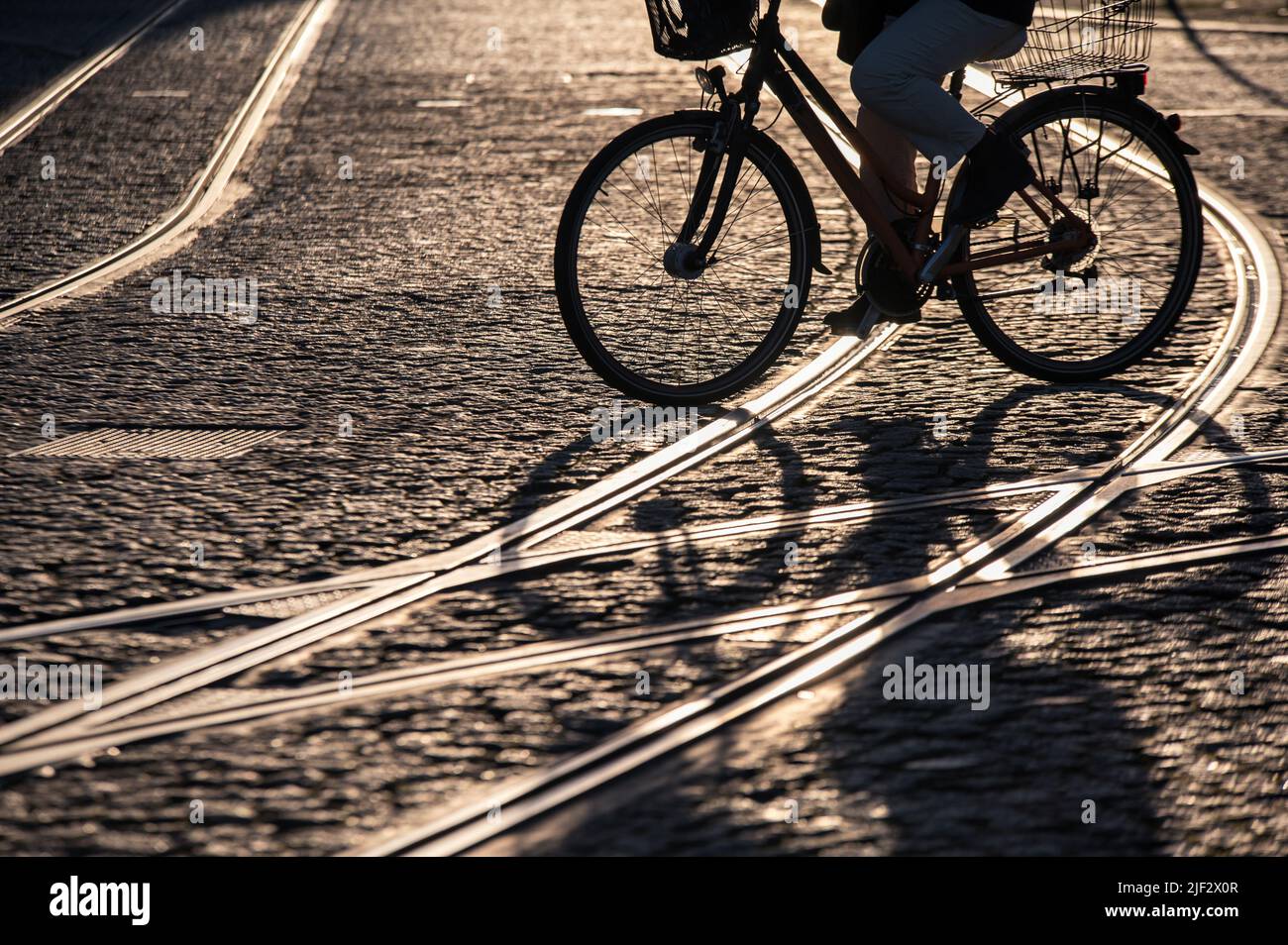 Environmentally friendly traffic by bike or tram presented as a trendy street photography Stock Photo