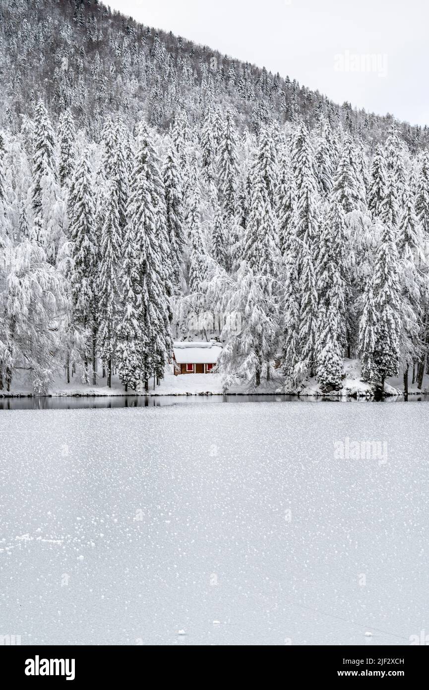 Snow winter in Fusine. Magic of the lower lake Stock Photo - Alamy