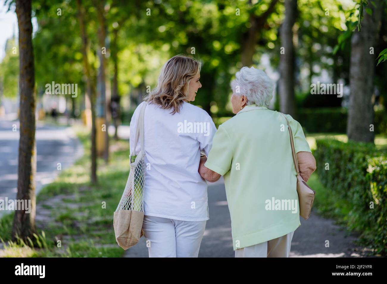 Woman hug rear view hi-res stock photography and images - Alamy