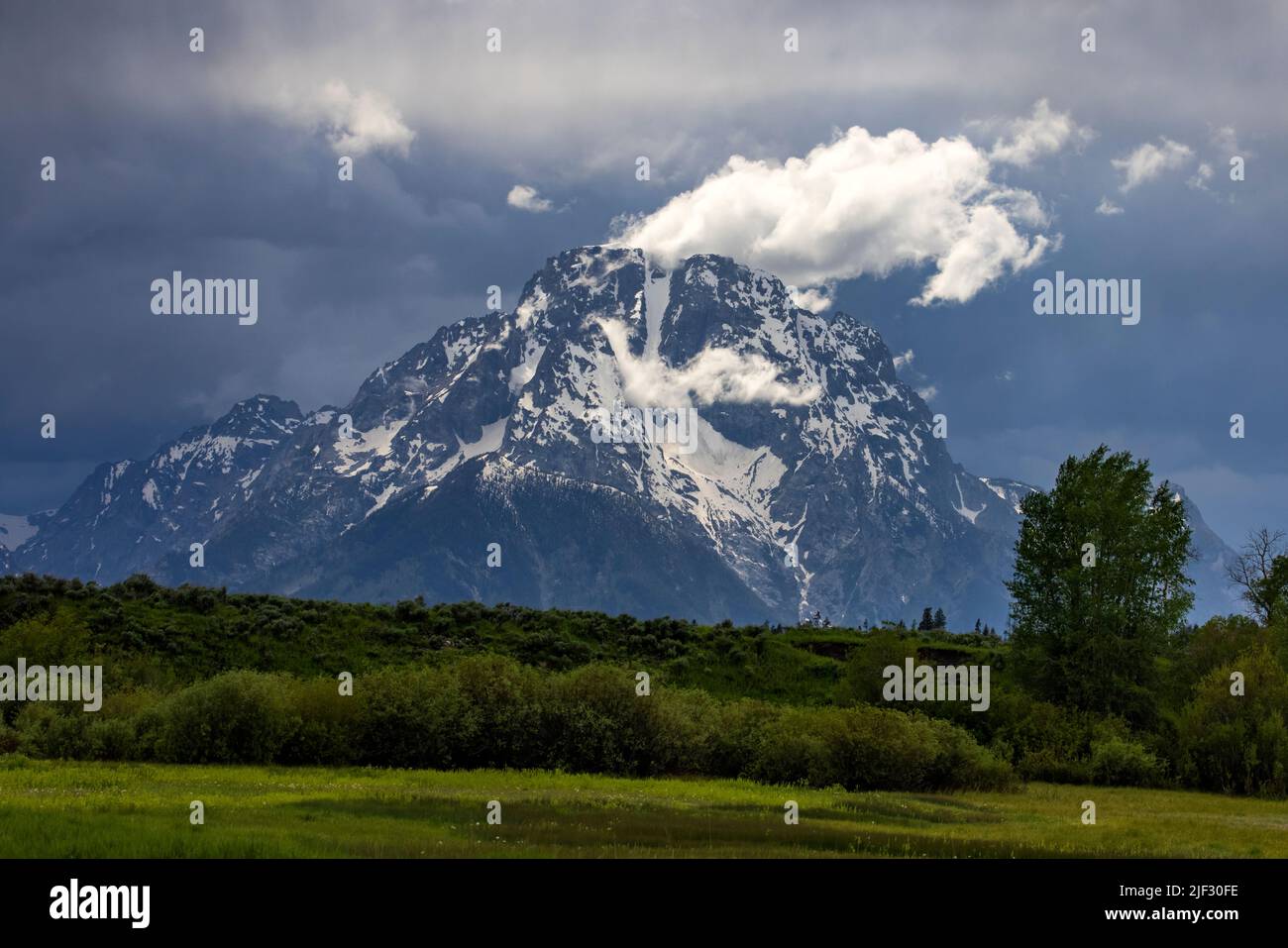 This is a view of Mount Moran, a landmark mountain on the north end of the Teton Range in Grand Teton National Park, Wyoming, USA. Stock Photo