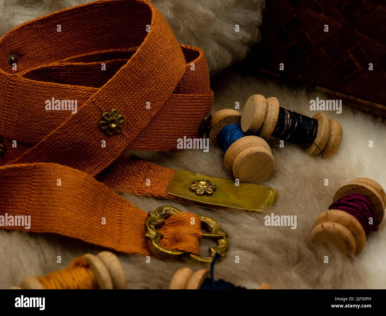 sewing set with spools of wool and a fabric belt on a fur Stock Photo