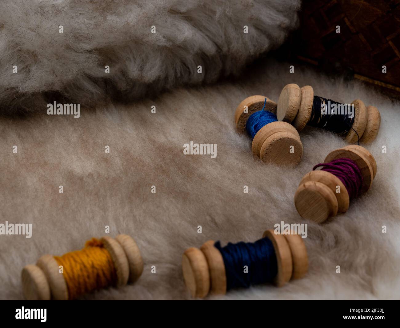 sewing set with wool coils on a fur coat Stock Photo