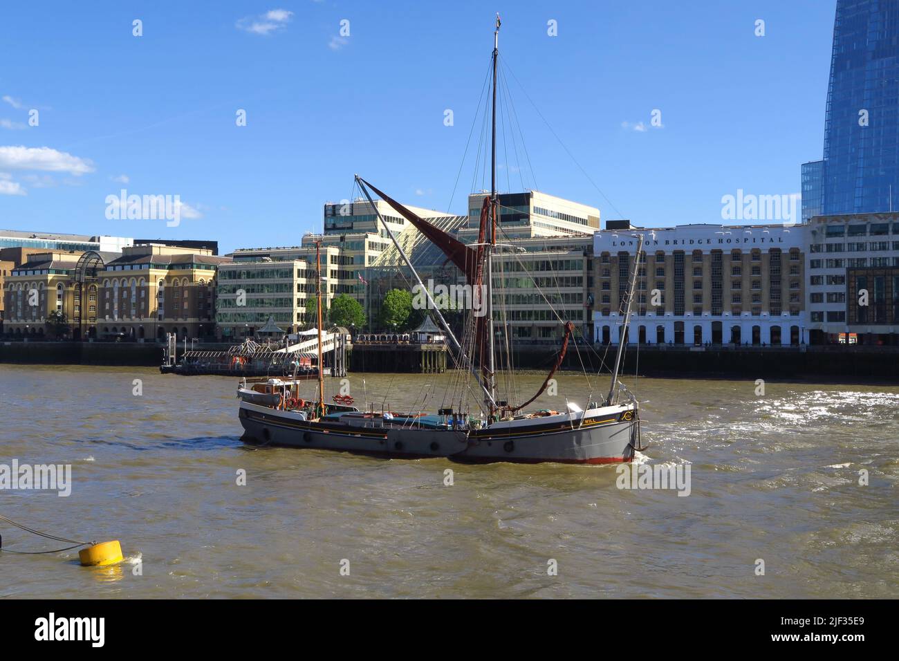 Thames sailing barge 'Will' on the River Thames near London Bridge Hospital. The vessel is one of the largest of its type. Stock Photo
