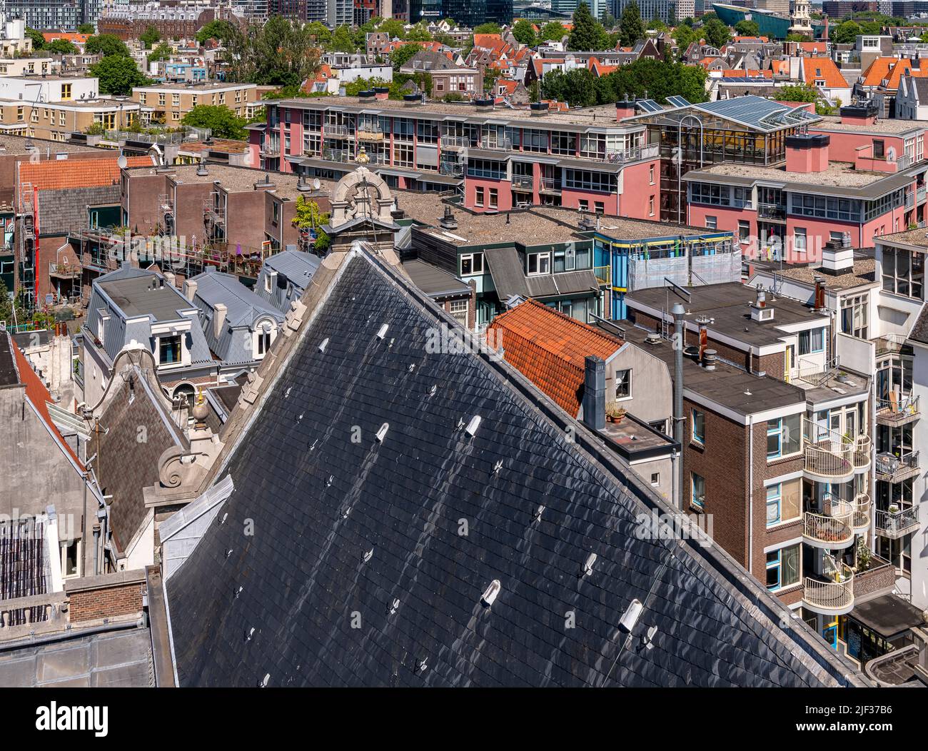 Bird's eye views over the rooftops of Amsterdam. Shot from the belfry of Zuiderkerk Tower, right in the heart of the city. Stock Photo